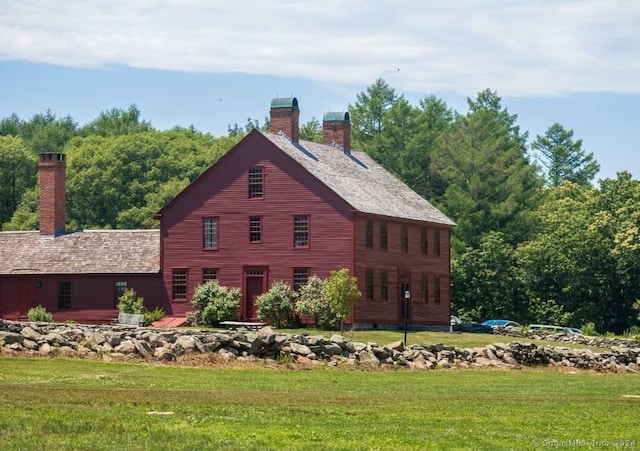 view of property exterior with a yard