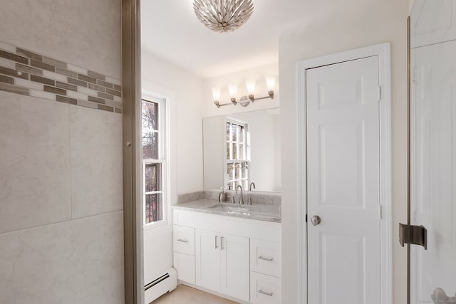 bathroom with vanity and a baseboard radiator