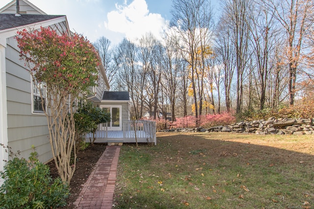 view of yard featuring a wooden deck