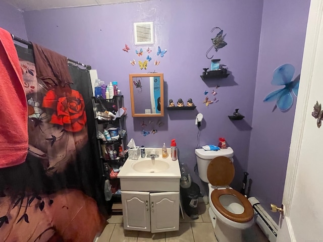 bathroom with toilet, vanity, tile patterned flooring, and baseboard heating