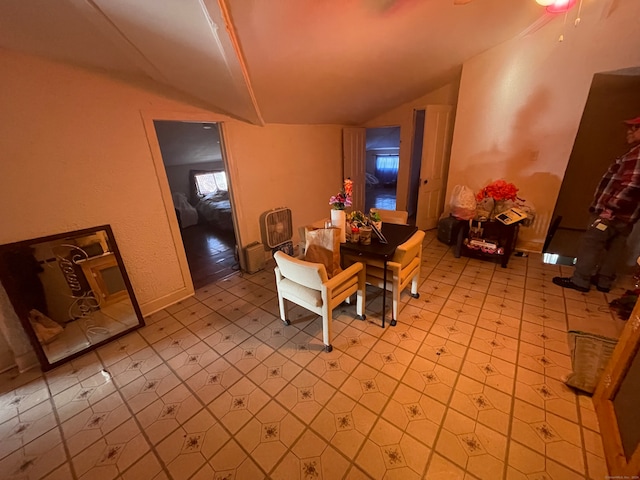 dining space with vaulted ceiling