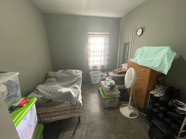 bedroom with dark parquet floors