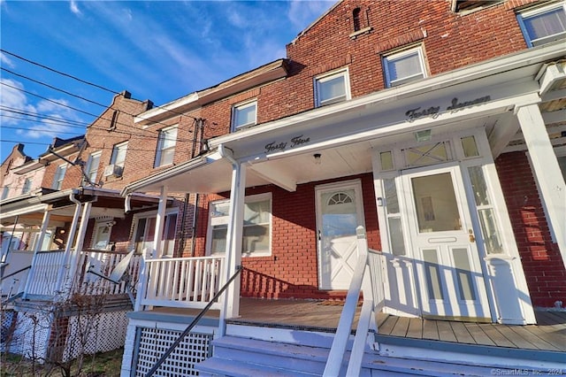 45 Ives St, Waterbury, CT 06704 - view of front of property featuring brick siding and a porch