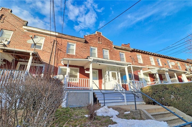45 Ives St, Waterbury, CT 06704 - townhome / multi-family property featuring a porch and brick siding