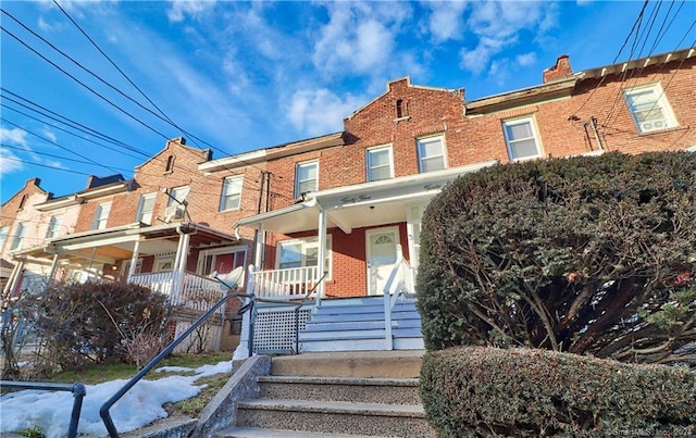 45 Ives St, Waterbury, CT 06704 - view of front facade featuring brick siding and covered porch