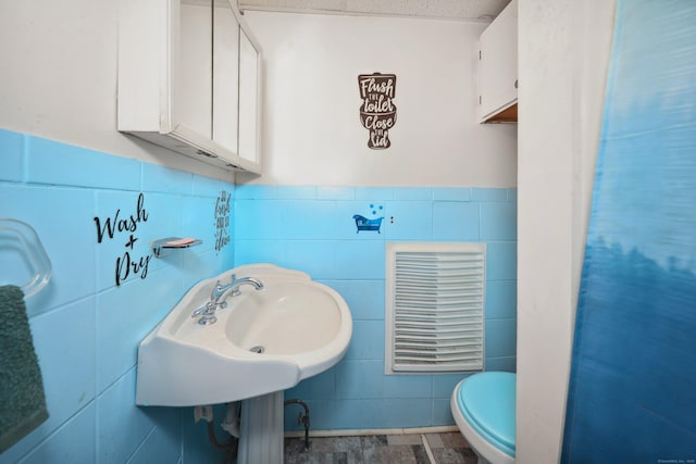 45 Ives St, Waterbury, CT 06704 - bathroom featuring toilet and tile walls