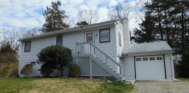 381 Bennetts Farm Rd, Ridgefield, CT 06877 - ranch-style home with driveway, an attached garage, and a front yard