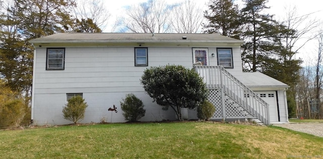381 Bennetts Farm Rd, Ridgefield, CT 06877 - ranch-style house with a front lawn and a garage