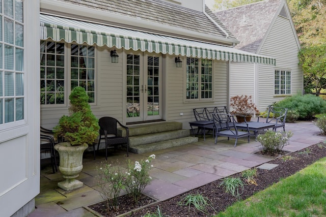 rear view of house featuring a patio area, french doors, and entry steps
