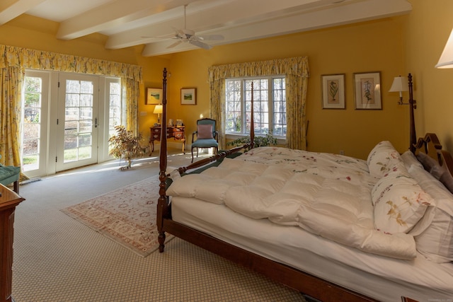 bedroom featuring access to outside, carpet, multiple windows, and beam ceiling