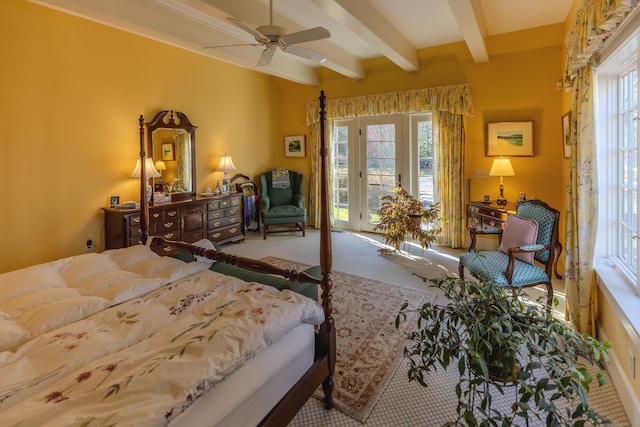 carpeted bedroom with beam ceiling, multiple windows, ceiling fan, and access to exterior