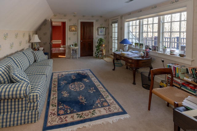 carpeted living room with vaulted ceiling