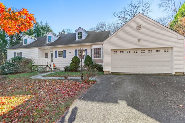 cape cod-style house with a garage