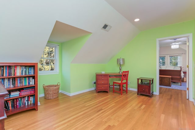 miscellaneous room with vaulted ceiling, light hardwood / wood-style flooring, plenty of natural light, and ceiling fan