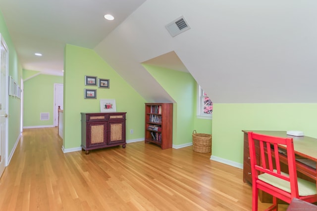 recreation room with light hardwood / wood-style flooring and lofted ceiling