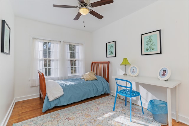 bedroom with ceiling fan and light hardwood / wood-style floors