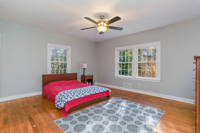 bedroom featuring hardwood / wood-style flooring and ceiling fan