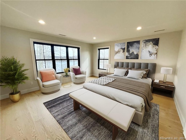 bedroom with hardwood / wood-style flooring