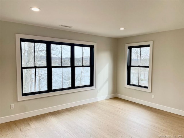 unfurnished room featuring light hardwood / wood-style flooring