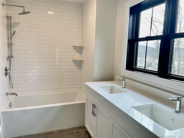 bathroom with vanity, tile patterned floors, and tiled shower / bath