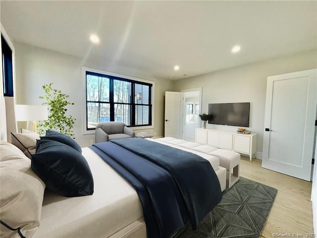 bedroom with light hardwood / wood-style floors