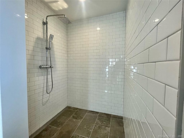 bathroom with tiled shower