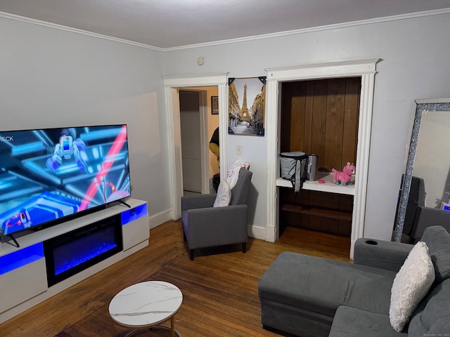 living room featuring ornamental molding and wood-type flooring