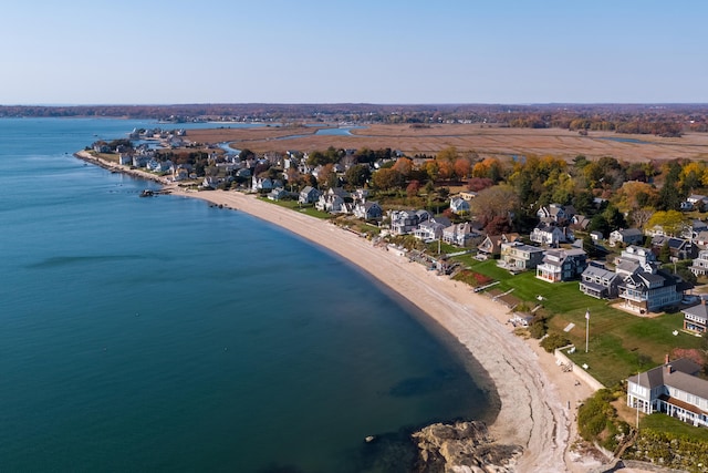 birds eye view of property with a beach view and a water view