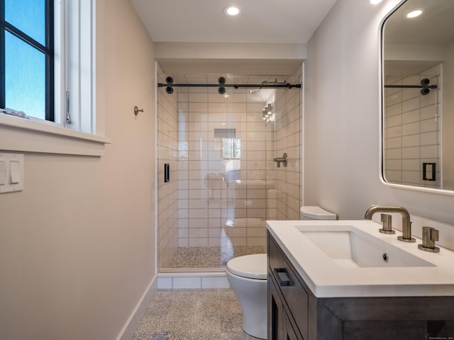 bathroom with toilet, a shower with door, vanity, and tile patterned flooring