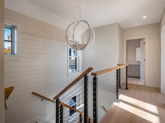 staircase featuring hardwood / wood-style floors