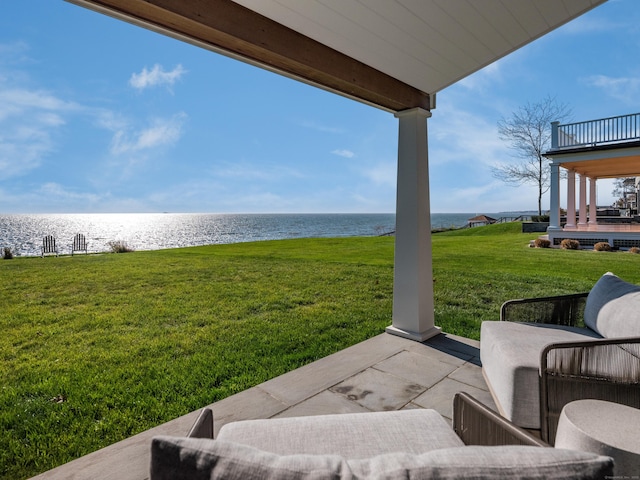 view of yard with a patio area and a water view