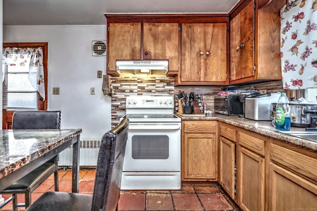 kitchen with decorative backsplash, electric range, and radiator