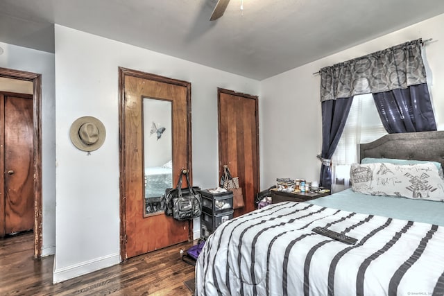 bedroom featuring dark hardwood / wood-style flooring and ceiling fan