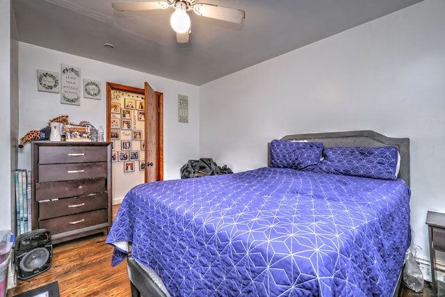 bedroom featuring hardwood / wood-style floors and ceiling fan