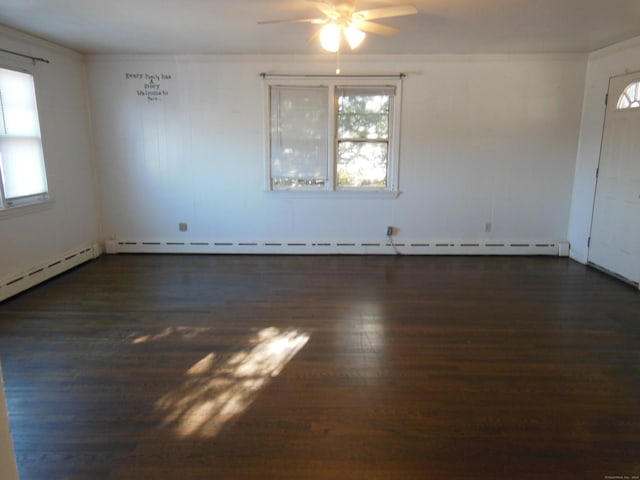 unfurnished room featuring ceiling fan, dark hardwood / wood-style flooring, and a baseboard radiator