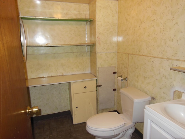 bathroom featuring vanity and toilet