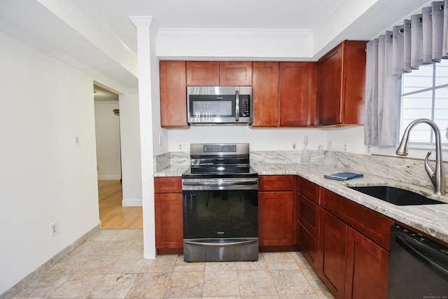 kitchen with light stone countertops, stainless steel appliances, crown molding, and sink