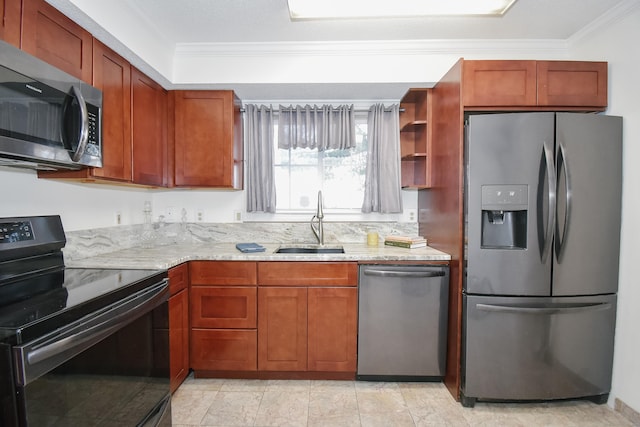 kitchen with light stone counters, sink, ornamental molding, and stainless steel appliances