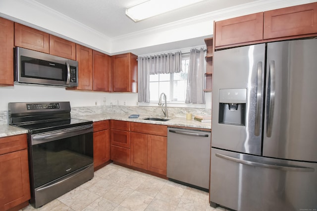 kitchen with crown molding, light stone countertops, sink, and appliances with stainless steel finishes