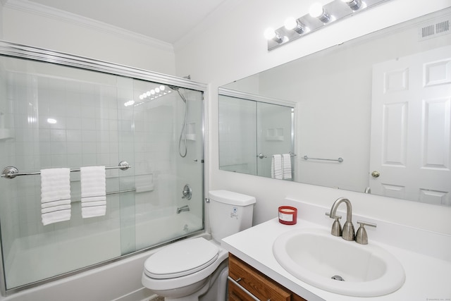 full bathroom with vanity, toilet, ornamental molding, and bath / shower combo with glass door