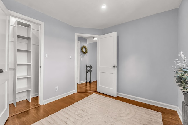 bedroom featuring wood-type flooring