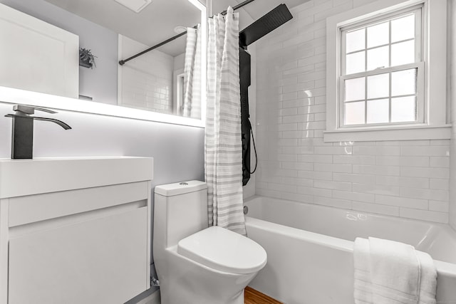 bathroom featuring shower / bathtub combination with curtain and toilet