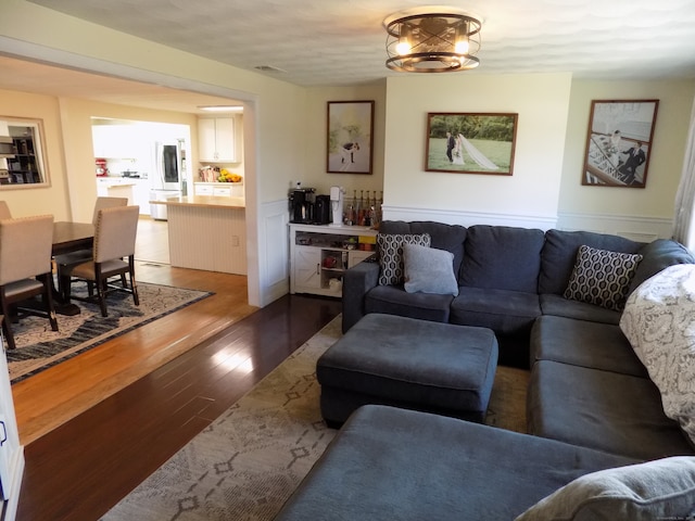 living room with dark wood-type flooring