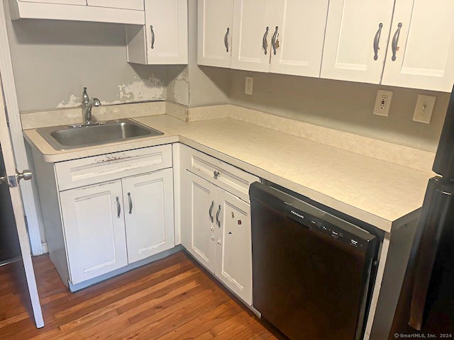 kitchen featuring white cabinetry, sink, dark hardwood / wood-style floors, and black dishwasher