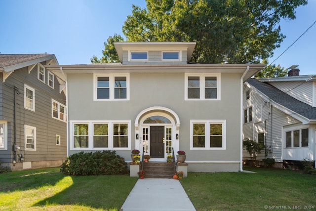 view of front of home featuring a front lawn