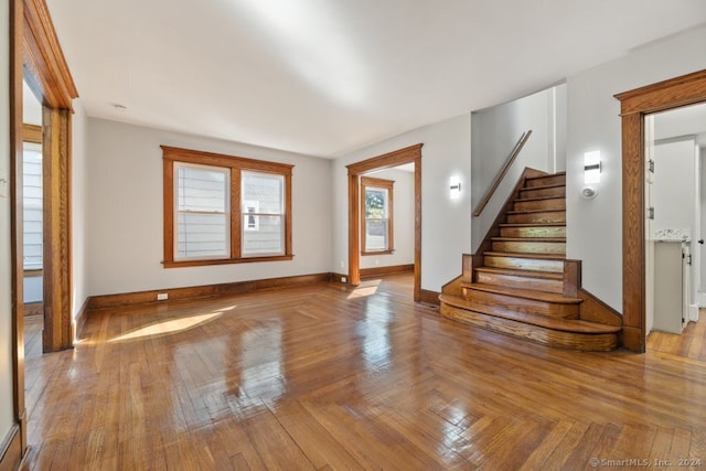 unfurnished living room with hardwood / wood-style flooring