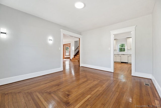 spare room featuring hardwood / wood-style floors