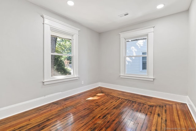 empty room featuring wood-type flooring