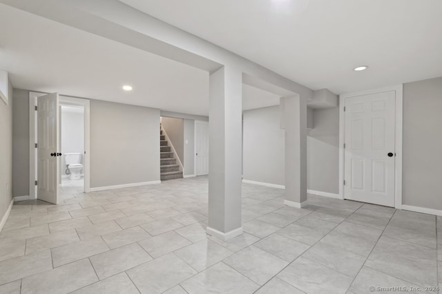 basement featuring light tile patterned floors