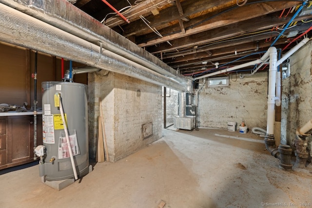 basement featuring heating unit and water heater